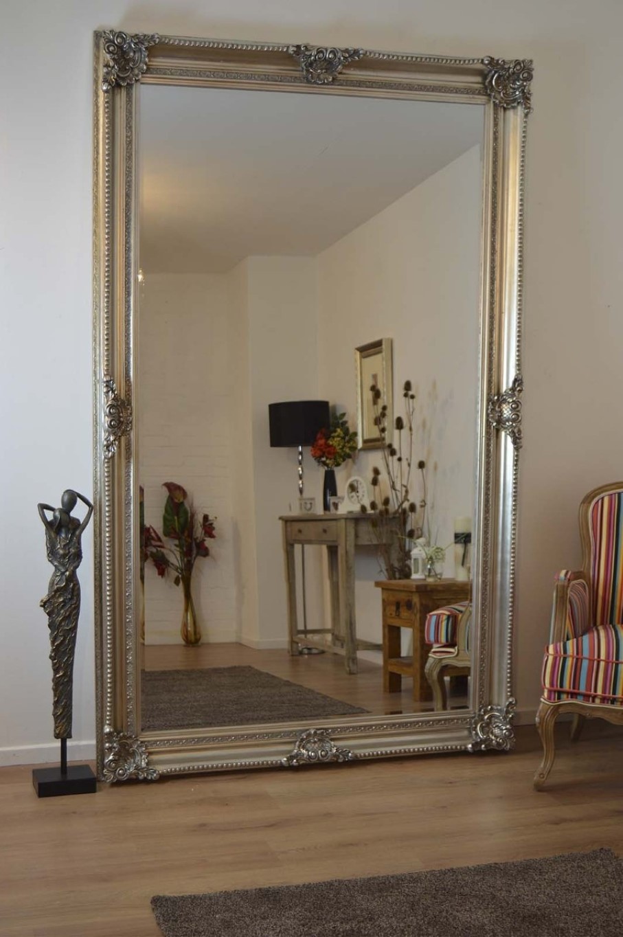 wonderful-large-wall-mirror-with-ornately-frame-design-idea-feat-antique-floor-display-and-stripes-accent-chair.jpg