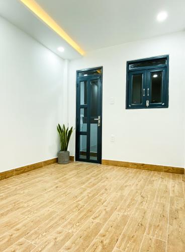 Phòng ngủ nhà phố Quận 7 Nhà phố trung tâm quận 7 thiết kế hiện đại, nội thất cơ bản.