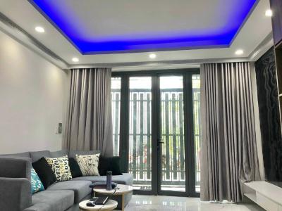 Phòng khách nhà phố Quận 7 Nhà phố Quận 7 diện tích sàn 128m2, sổ hồng riêng kèm đầy đủ nội thất.