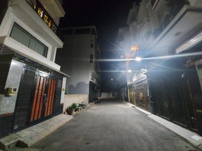 Đường trước nhà phố Quận Gò Vấp Nhà phố diện tích 64m2, kết cấu 1 trệt 3 lầu và sân thượng, sổ hồng riêng.