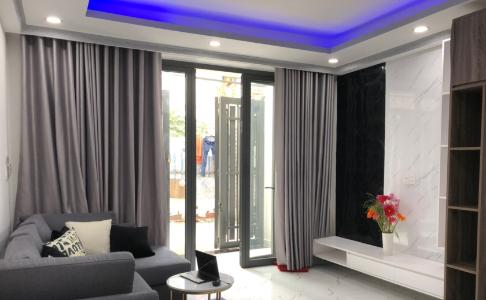 Phòng khách nhà phố Quận 7 Nhà phố Quận 7 diện tích sàn 128m2, sổ hồng riêng kèm đầy đủ nội thất.