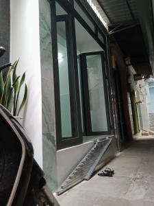 Mặt tiền nhà phố Nhà phố Quận 7 hướng Tây diện tích đất 3mx7m, hẻm xe máy.