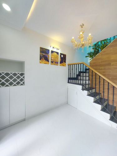 Nhà phố Quận Bình Thạnh Nhà phố thiết kế 1 trệt, 1 lầu đúc kỹ lưỡng, khu nhà lâu cao tầng xung quanh.