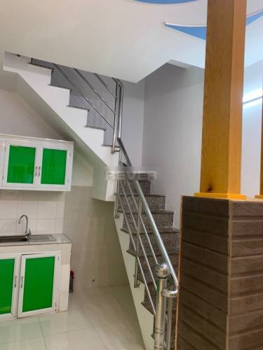 Nhà phố Quận 7 Nhà phố thiết kế 1 trệt, 2 lầu đúc chắc chắn, cửa hướng Đông Bắc thoáng mát.