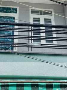 Mặt tiền nhà phố Quận 7 Nhà phố thiết kế 1 trệt, 2 lầu đúc chắc chắn, cửa hướng Đông Bắc thoáng mát.