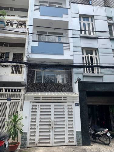 Nhà phố Quận 10 Nhà phố thiết kế hiện đại gồm 8 phòng ngủ, diện tích 43m2 không nội thất.