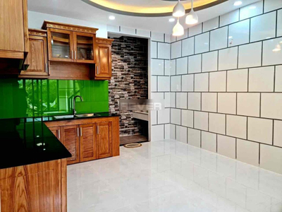 Nhà phố Quận Bình Thạnh Nhà hẻm xe hơi đường Nơ Trang Long thiết kế 1 trệt, 1 lửng và 3 lầu.