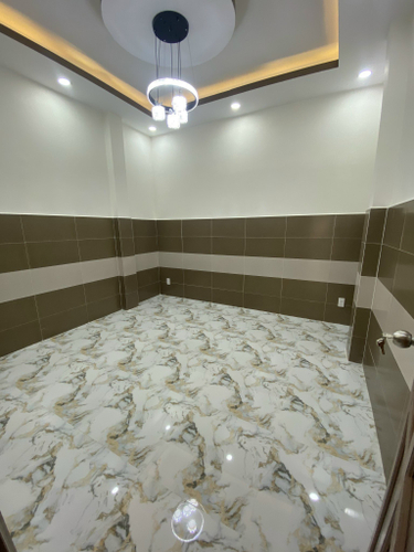 Nhà phố Quận 6 Nhà phố thiết kế 1 trệt, 2 lầu và sân thượng, cửa hướng Nam mát mẻ.